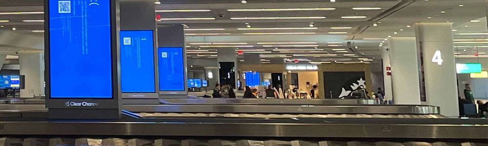Photo of Blue screens of death at LGA airport from the CrowdStrike 2024 July outage.|||||