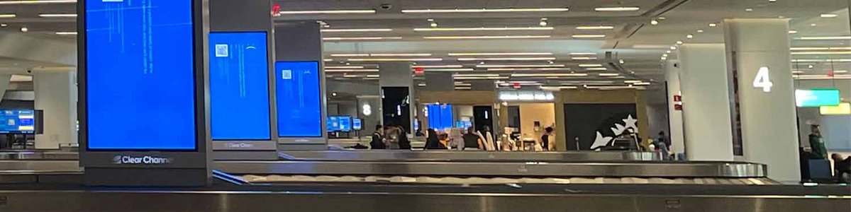Photo of Blue screens of death at LGA airport from the CrowdStrike 2024 July outage.|||||