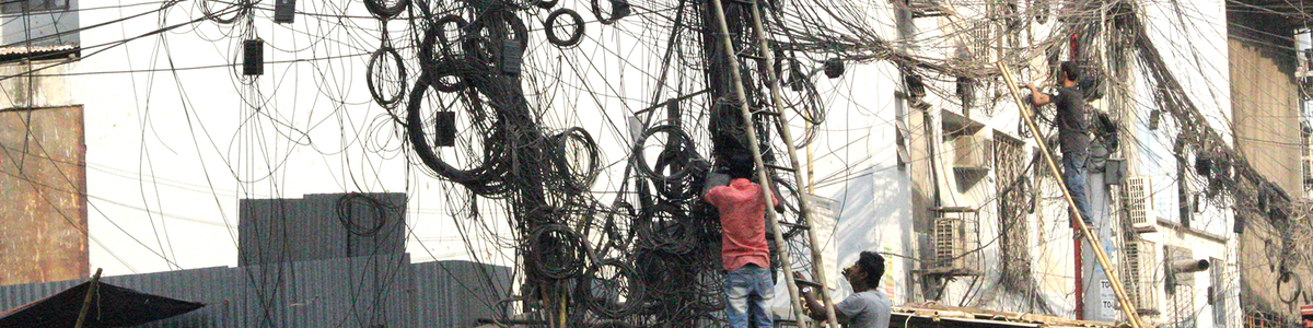 Cables hanging from telephone poles in Bangladesh||||||||||