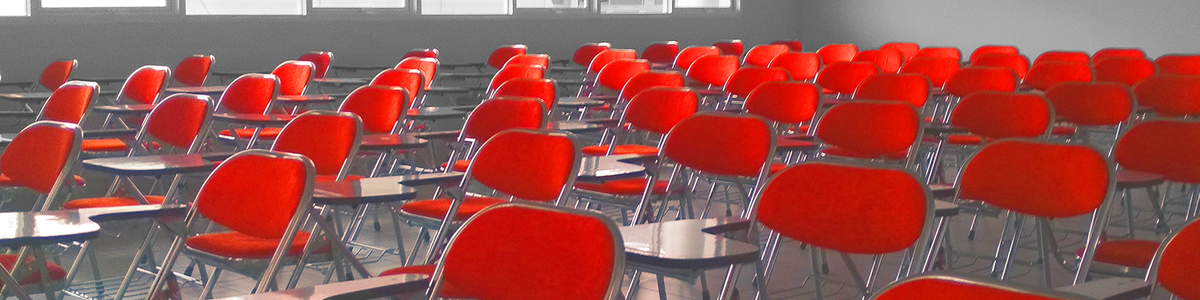 Classroom with red chairs and tables||||||