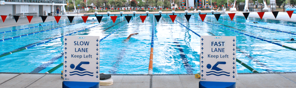 Swimming pool with fast and slow lane signs||||