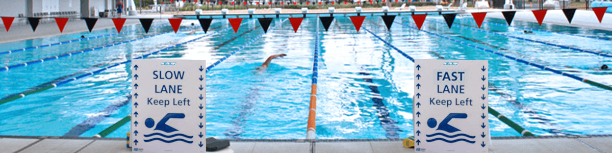 Swimming pool with fast and slow lane signs||||