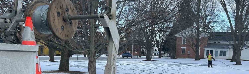 Photo of workers installing fiber optic cable in Vermont, USA