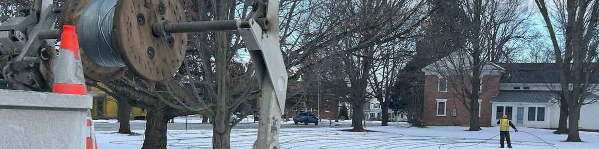 Photo of workers installing fiber optic cable in Vermont, USA