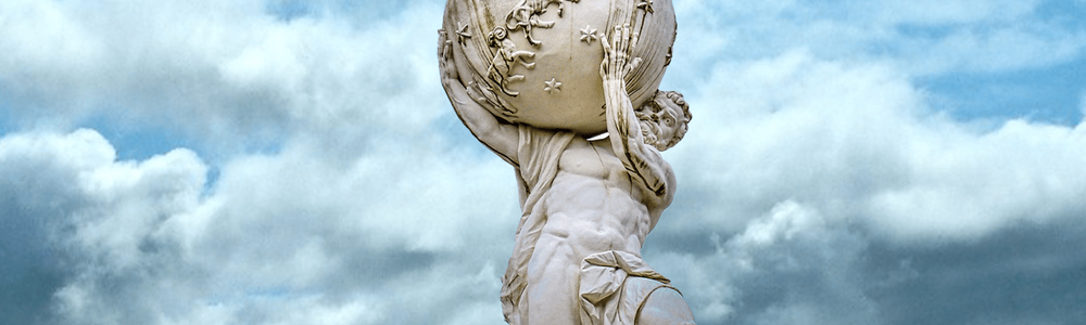 Photo of a statue holding the world on its shoulders.|||