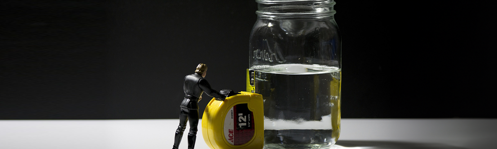 Photo of a half full glass of water|||