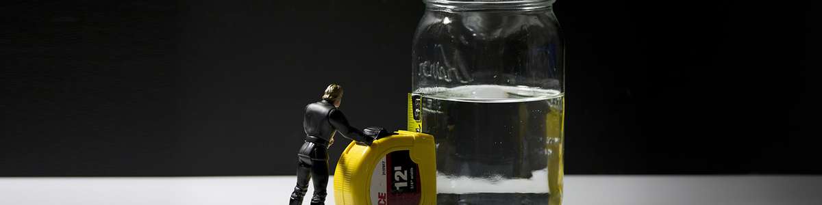 Photo of a half full glass of water|||