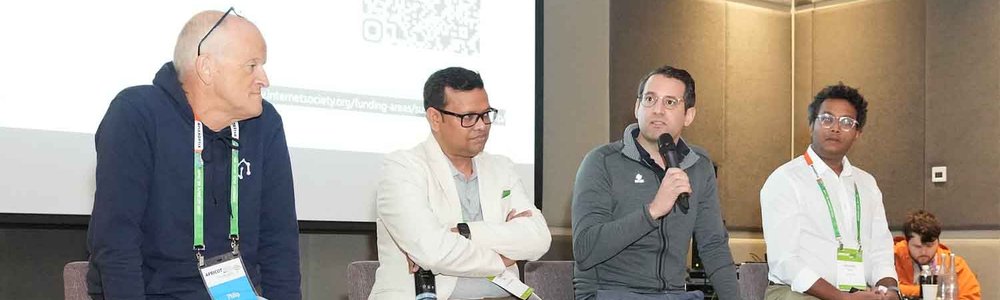 Photo of panelists at APRICOT 2025