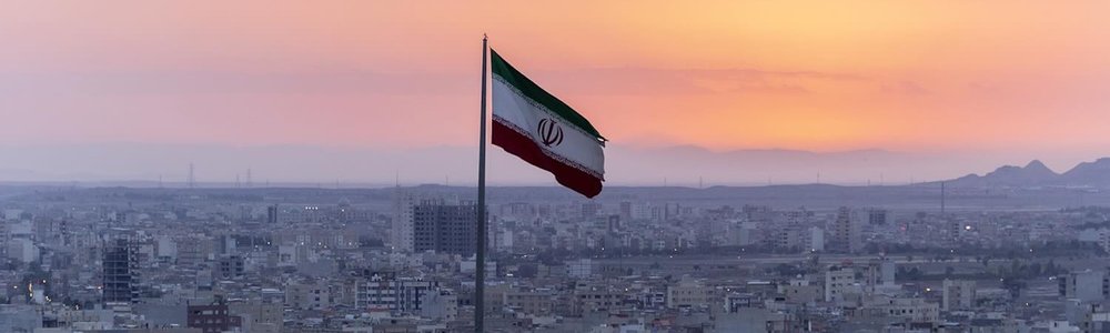 Photo of Iran flag with city in the background|||||