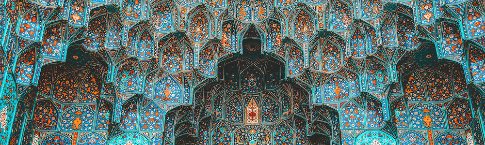 red blue and yellow floral textile in building in Iran|