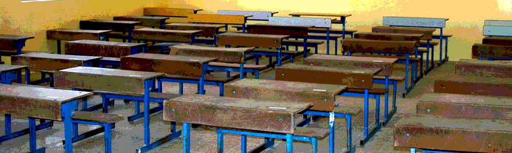 Empty classroom in Iraq with desks, no people