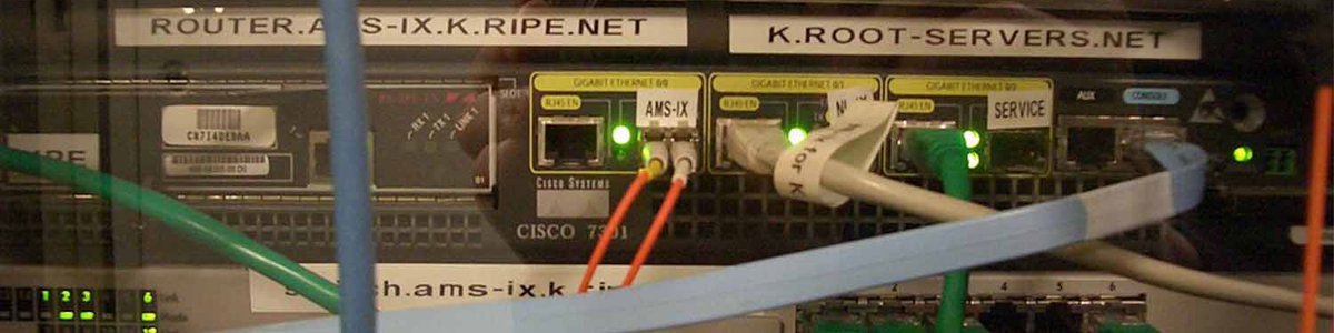 Photo of a Cisco 7301 router and a Juniper M7i, part of the K root-server instance at AMS-IX|||