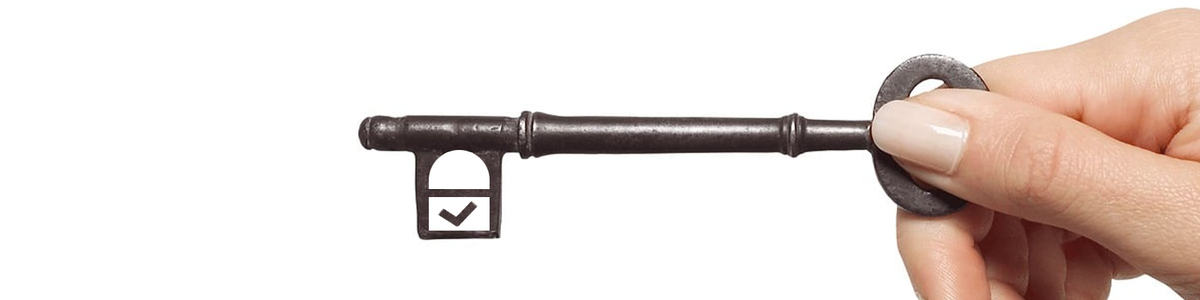 Hand holding a key|||