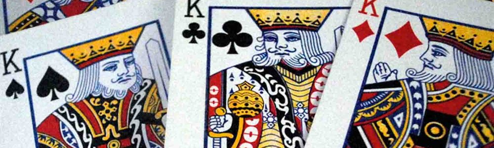 Photo of three king playing cards