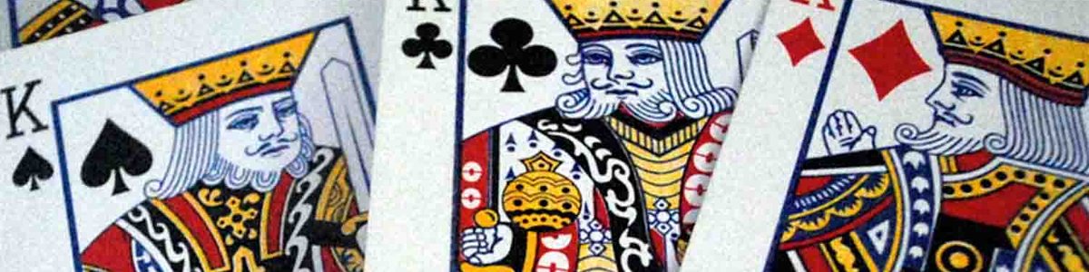 Photo of three king playing cards