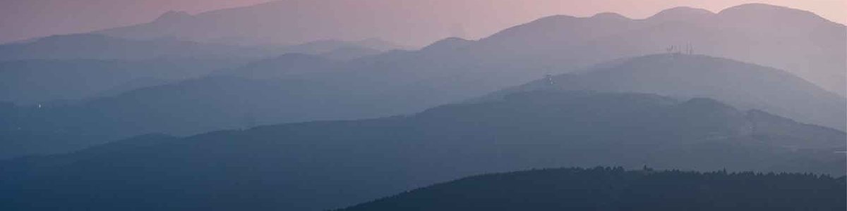 Photo of several mountain ranges of varying heights||