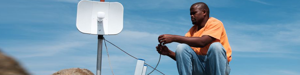 Tomas Sikanisi installing a WiFi antenna at a homestead in the village of Mankosi in the Eastern Cape province of South Africa on 27 September 2018.