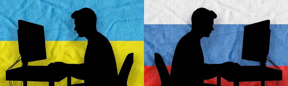 Two silhouettes of people typing a monitors back to back against a backdrop of a Ukraine and Russian flag|||