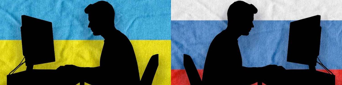 Two silhouettes of people typing a monitors back to back against a backdrop of a Ukraine and Russian flag|||