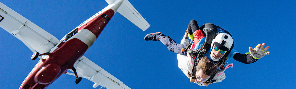 Skydiver jumping out of plane