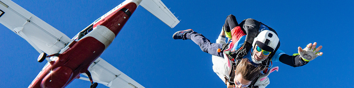Skydiver jumping out of plane