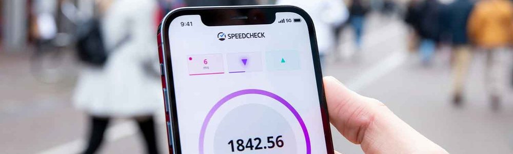Photo of a smartphone screen showing the results of a local mobile broadband speedtest.||