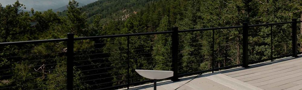 Photo of a Starlink dish set up in a forest.|||