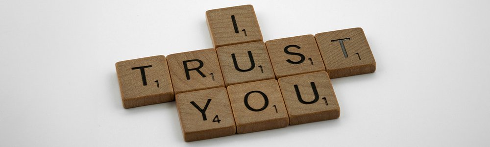 Scrabble letters spelling out 'I trust you'|Time series graph showing the percentage of partially and fully protected routes globally