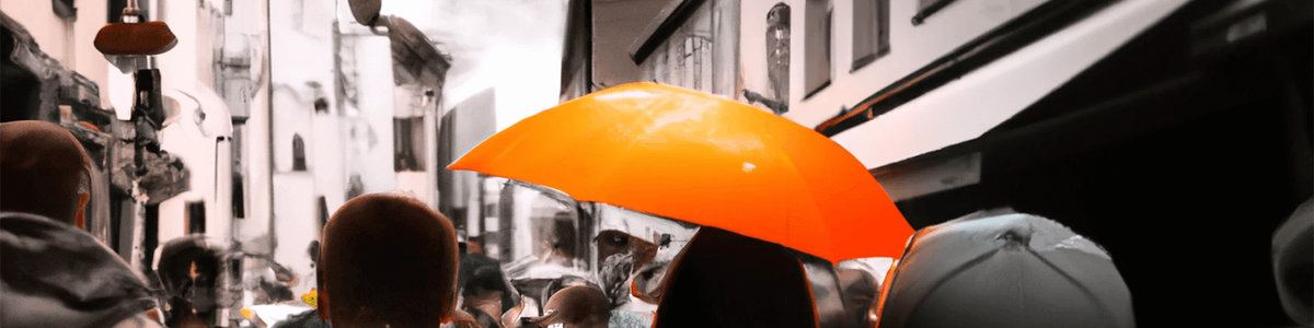 street full of people with one person holding an umbrella||||
