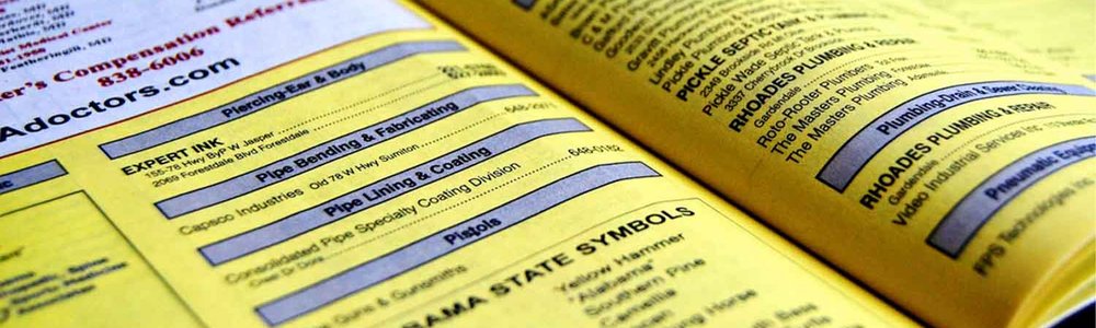 Photo of an open yellow pages book||
