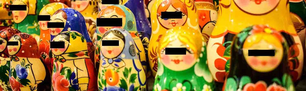 Photo of babushka dolls with black boxes over eyes||||