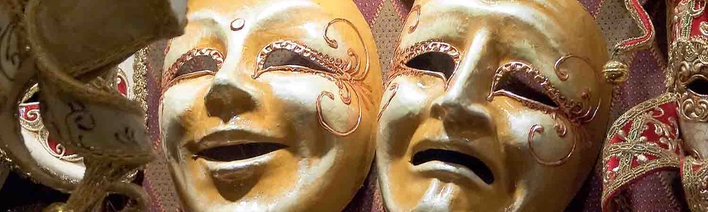 Photo of a happy and a sad mask