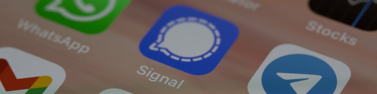 A close up of the screen of a mobile phone showing messaging apps, including Whatsapp, Signal and Telegram|An alert message in French that was shown to Telegram users in error.