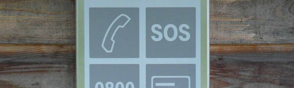Sign showing a picture of a phone and SOS||||