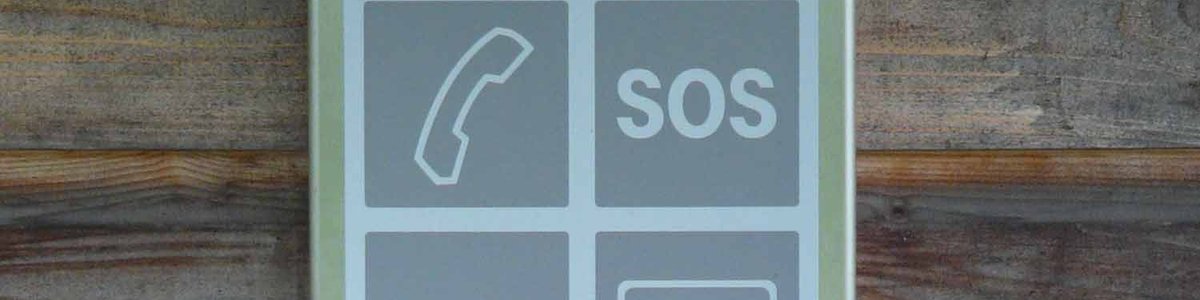 Sign showing a picture of a phone and SOS||||
