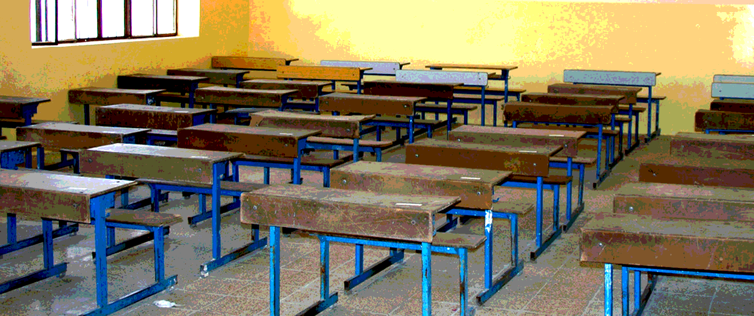 Empty classroom in Iraq with desks, no people
