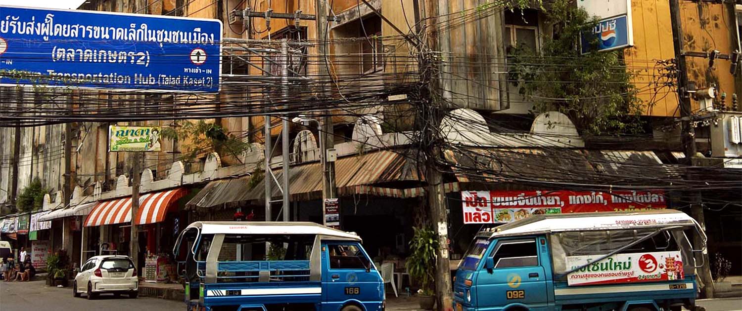 Photo of fiber cables hung up above a street in Thailand.