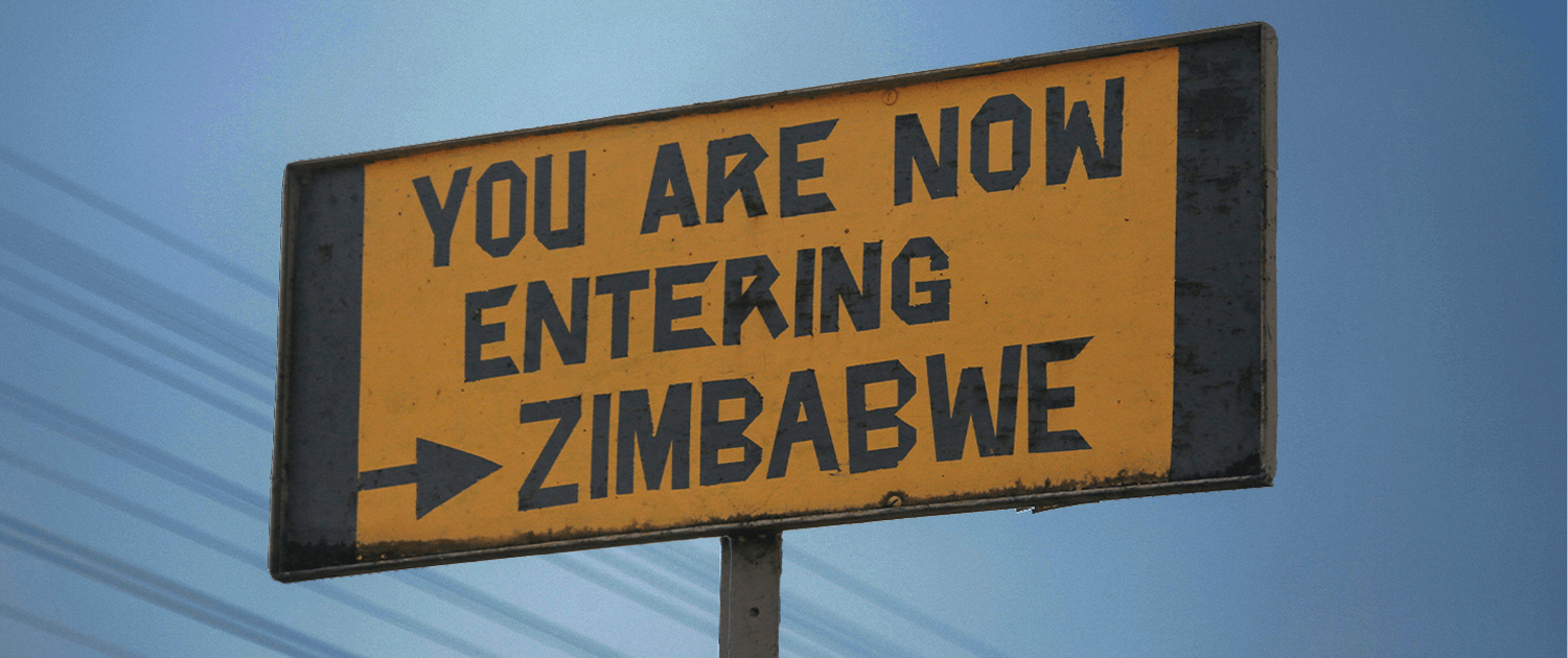 Road sign saying 'You are now entering Zimbabwe'