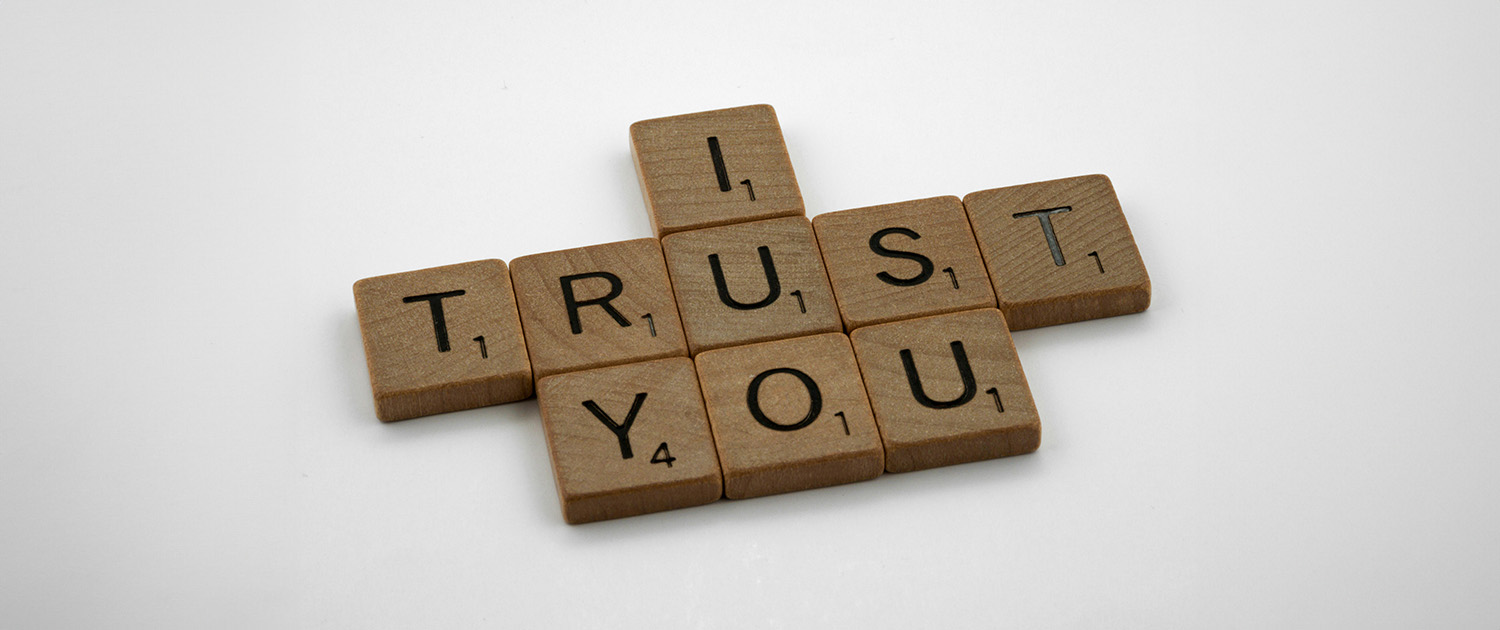 Scrabble letters spelling out 'I trust you'