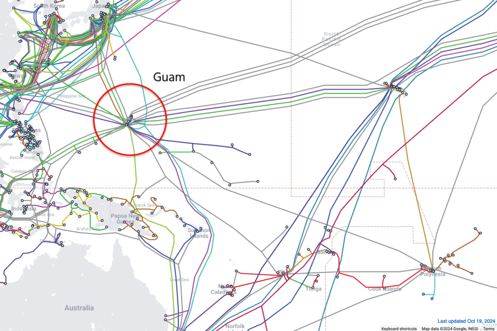 Map of Pacific showing submarine cables with Guam circled.