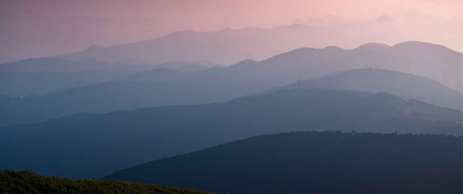 Photo of several mountain ranges of varying heights