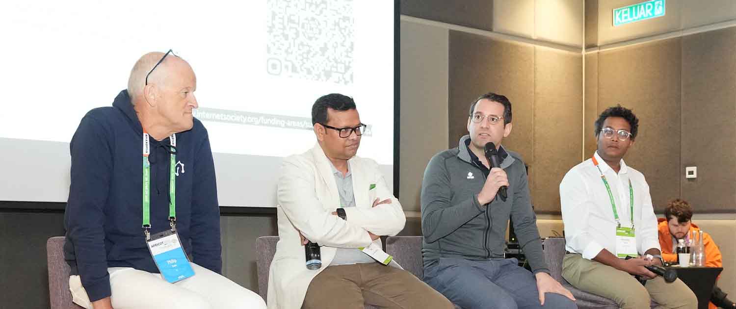 Photo of panelists at APRICOT 2025